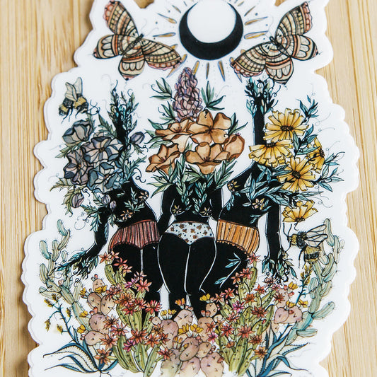 hand-painted watercolor sticker of three feminine figures blooming with desert botanicals. waterproof matte vinyl, designed by tucson artist marcy ellis. a gift for your sister in spirit.