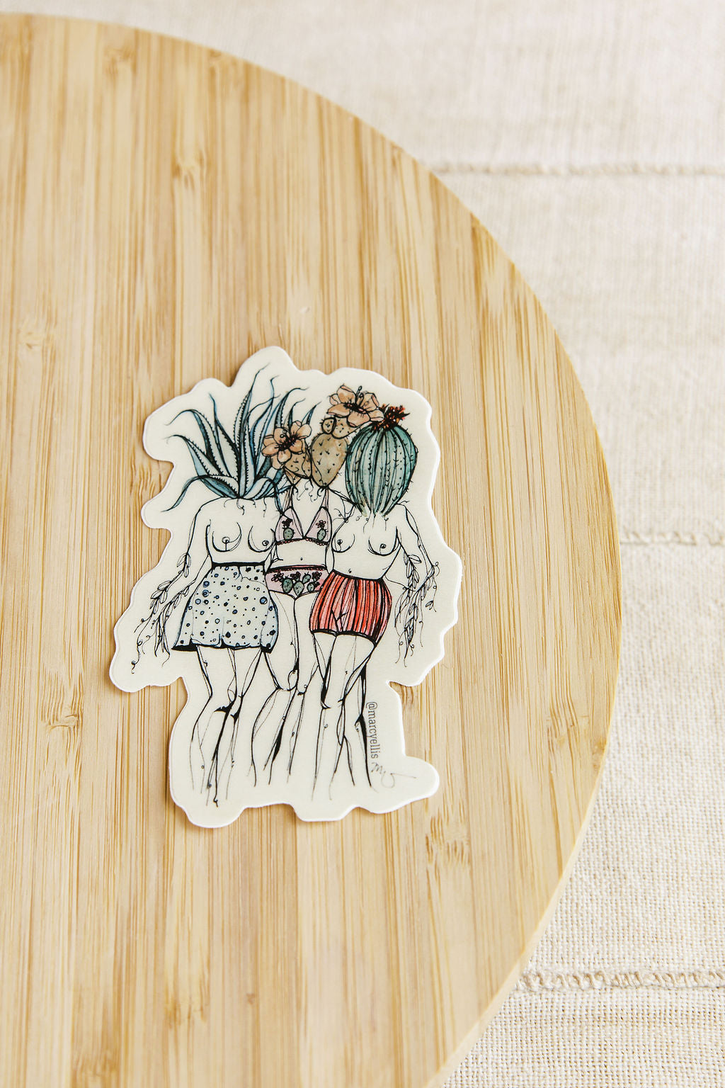 Sticker of two people with plants on a wooden surface