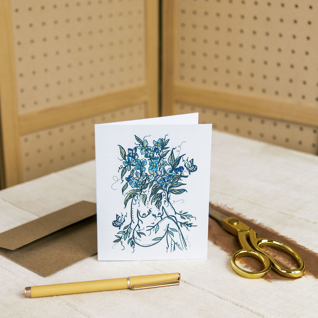 baby blues sister greeting card of watercolor woman with soft blue blooms by marcy ellis