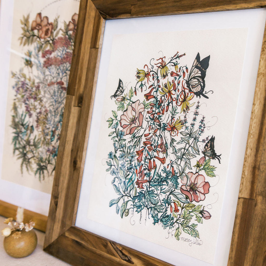 Framed floral artwork with butterflies on a white background