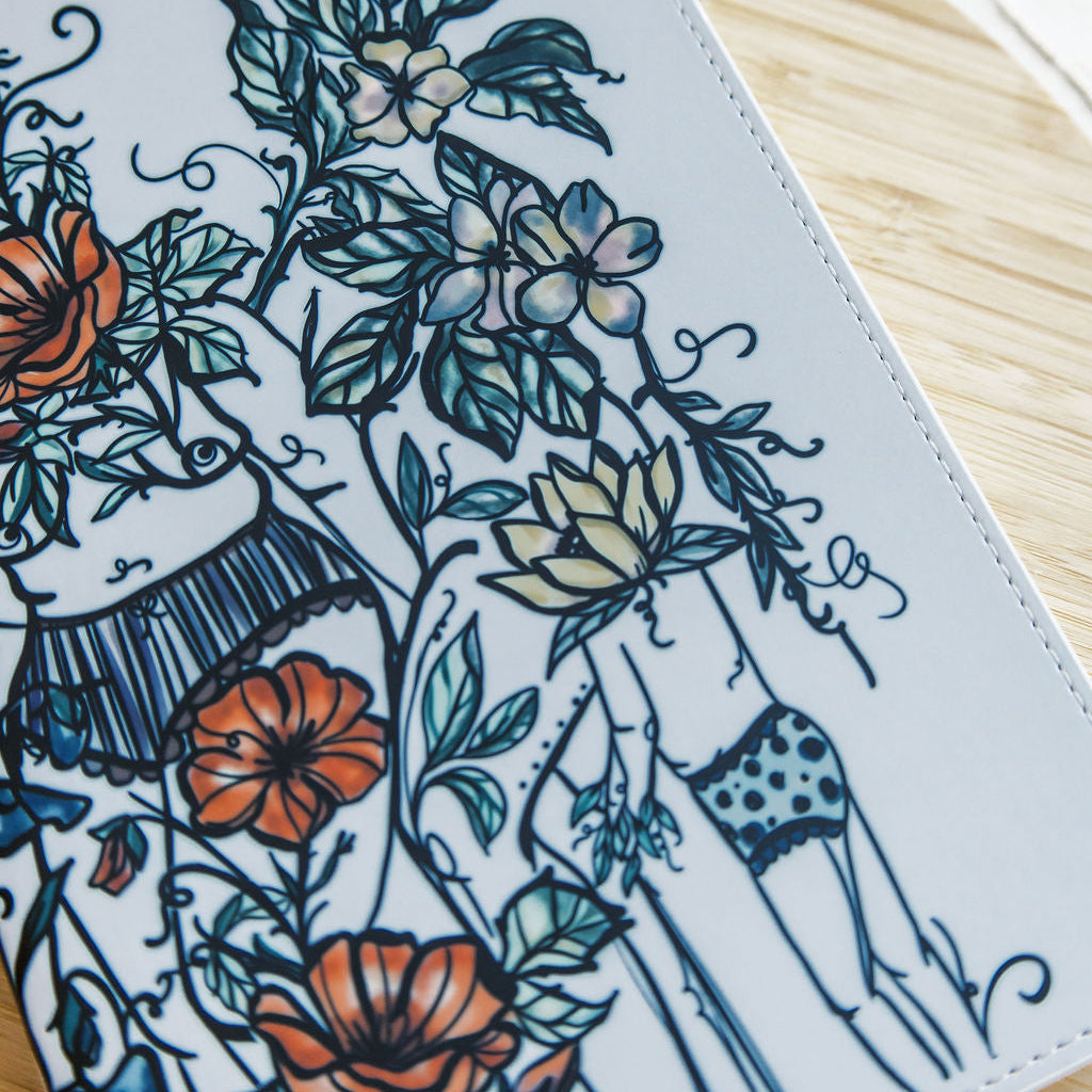 a5 lined journal with watercolor feminine botanical figures wrapping the front and back covers. 190 pages, faux leather cover. hand-painted design by artist Marcy Ellis in Tucson, AZ.
