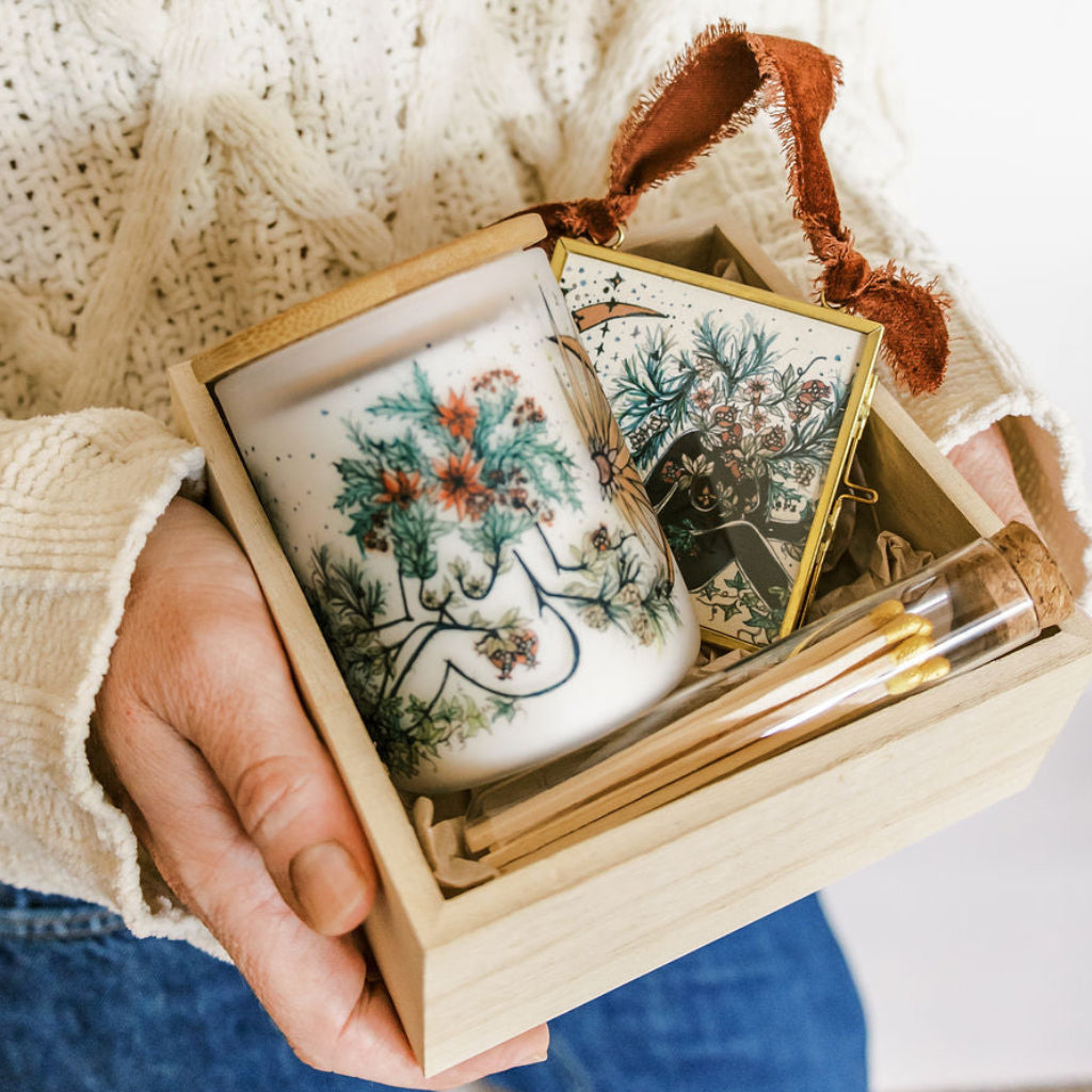 yule winter solstice candle, glass ornament and matches packed in a wooden gift box by marcy ellis