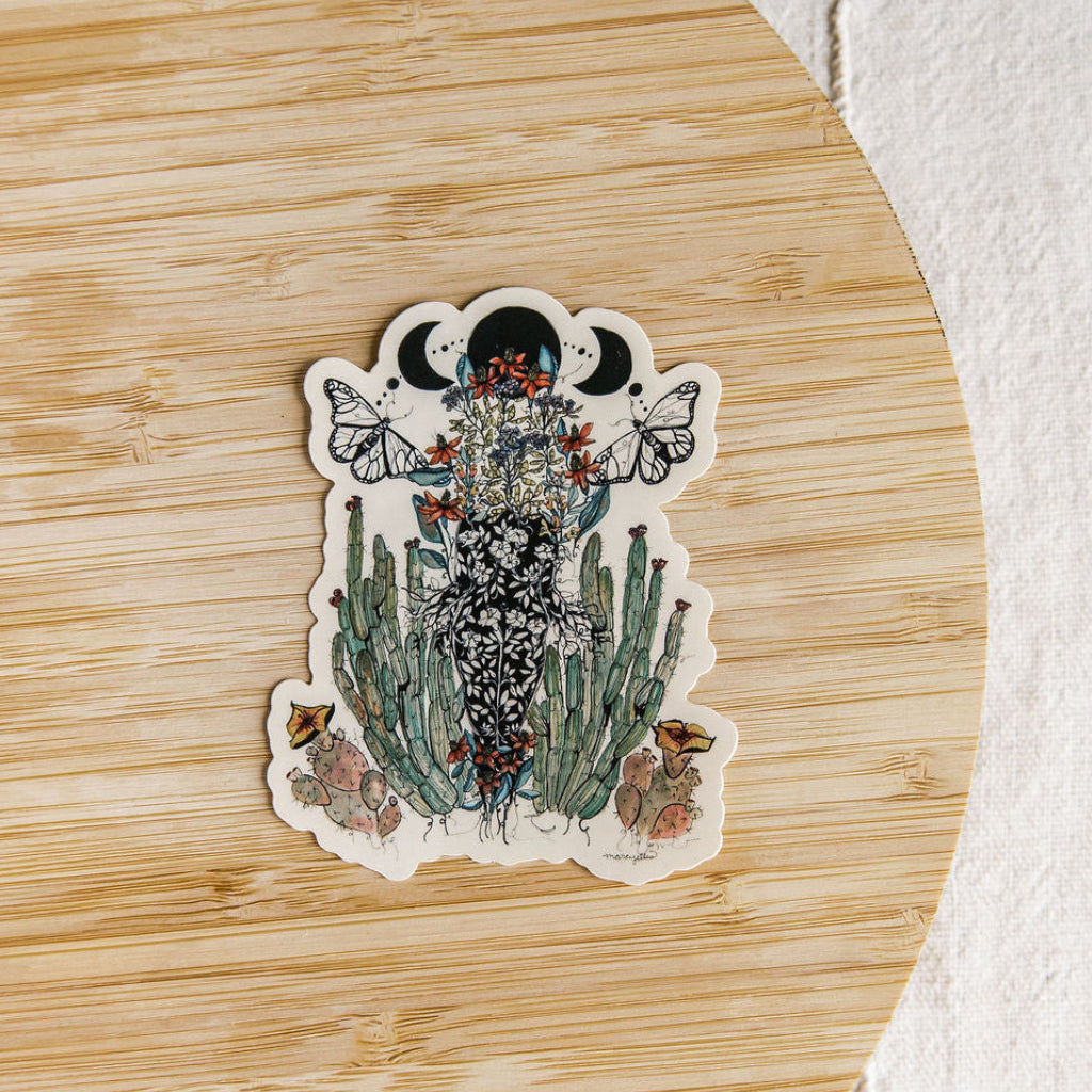hand-painted watercolor sticker of a feminine figure blooming with desert cacti and a lunar phase. waterproof matte vinyl, designed by tucson artist marcy ellis. a gift for your sister in spirit.