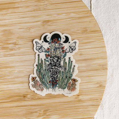 hand-painted watercolor sticker of a feminine figure blooming with desert cacti and a lunar phase. waterproof matte vinyl, designed by tucson artist marcy ellis. a gift for your sister in spirit.