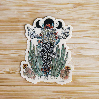 hand-painted watercolor sticker of a feminine figure blooming with desert cacti and a lunar phase. waterproof matte vinyl, designed by tucson artist marcy ellis. a gift for your sister in spirit.