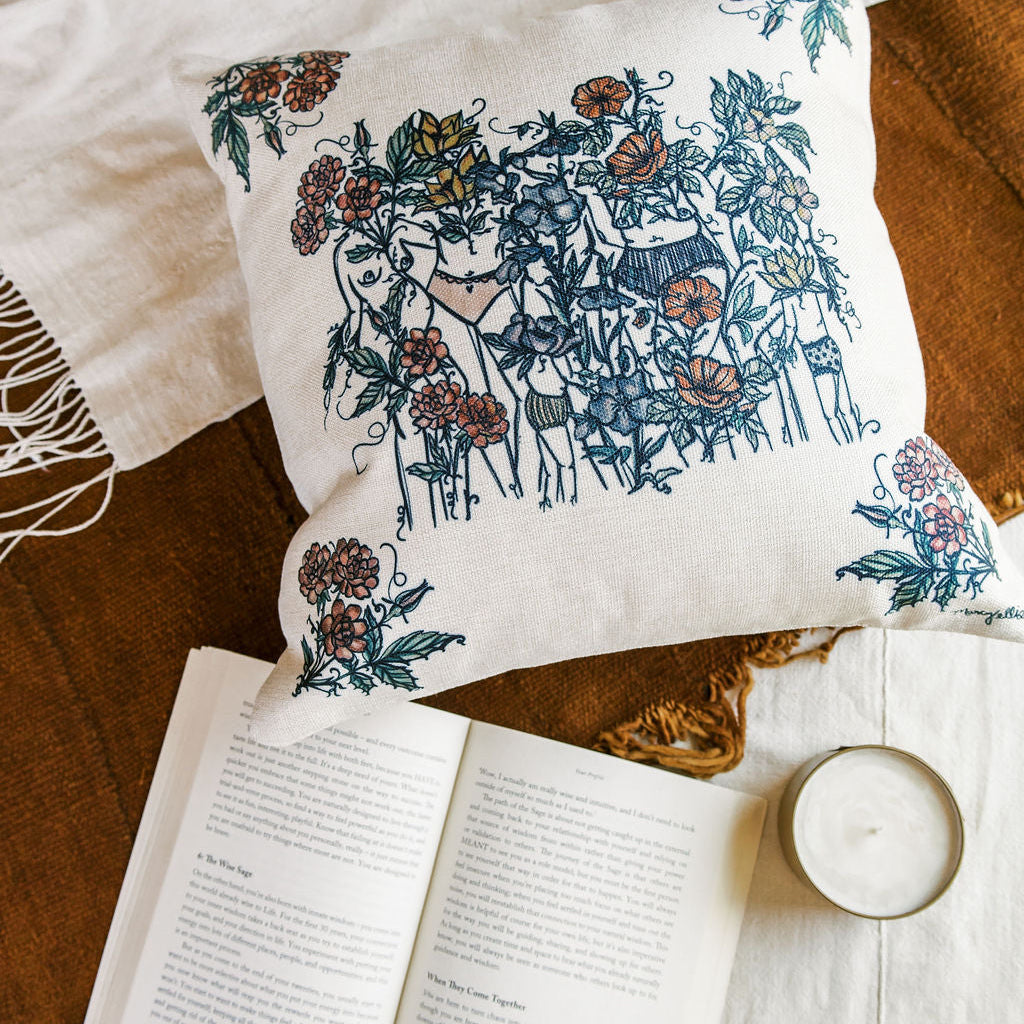 natural linen pillow cover featuring hand-drawn feminine figures blooming among watercolor wildflowers. botanical home decor by tucson artist marcy ellis.