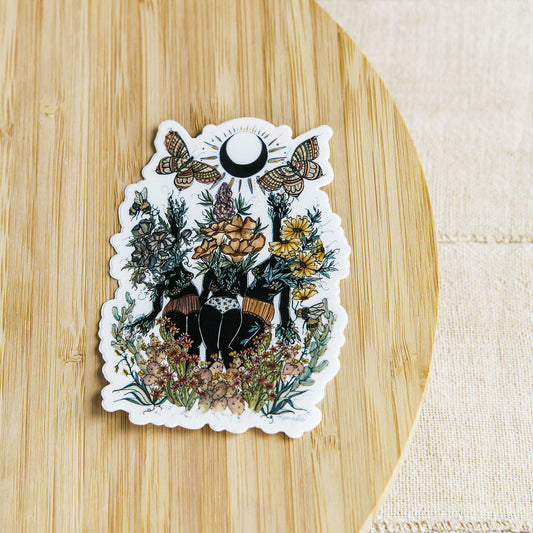 hand-painted watercolor sticker of three feminine figures blooming with desert botanicals. waterproof matte vinyl, designed by tucson artist marcy ellis. a gift for your sister in spirit.