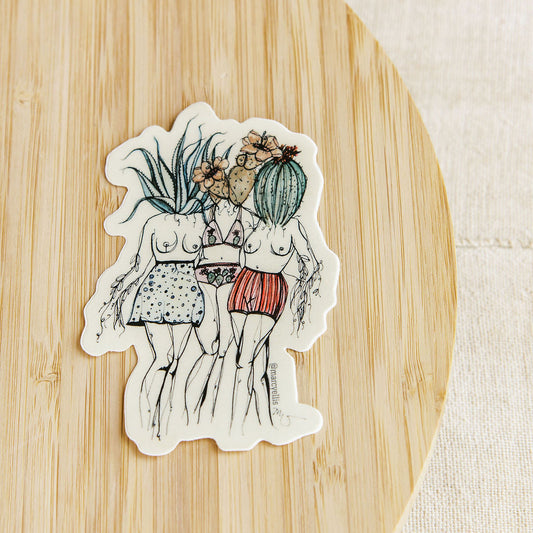 Sticker of two people with plants on a wooden surface