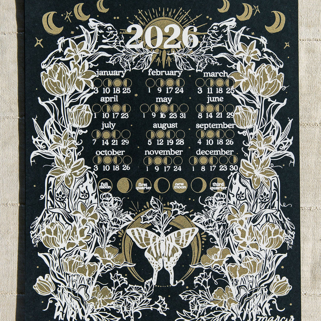 2026 calendar with floral and celestial design on a black background