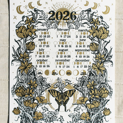2026 calendar with floral and butterfly design on a textured beige background