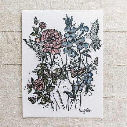 A botanical art print featuring two botanical figures pink roses, blue flowers, and hummingbirds by Marcy Ellis