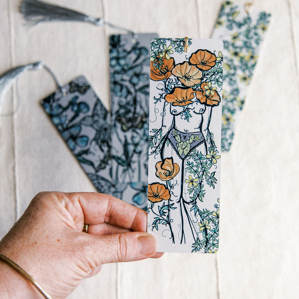a metal bookmark with a botanical feminine figure by Marcy Ellis  