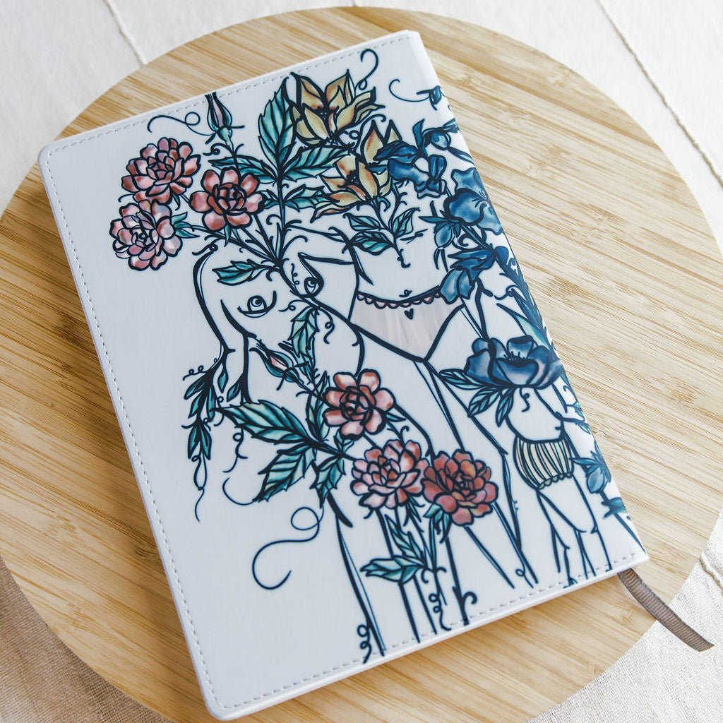 a5 lined journal with watercolor feminine botanical figures wrapping the front and back covers. 190 pages, faux leather cover. hand-painted design by artist Marcy Ellis in Tucson, AZ.