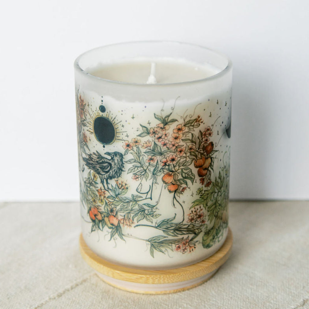 mabon fall equinox soy candle with botanical artwork wrapped around frosted glass jar