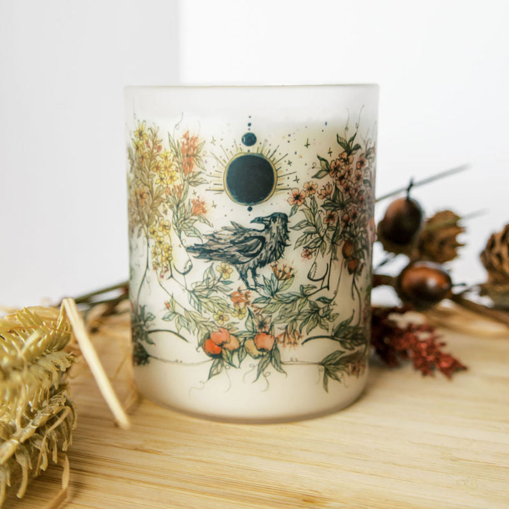 mabon fall equinox soy candle with botanical artwork wrapped around frosted glass jar